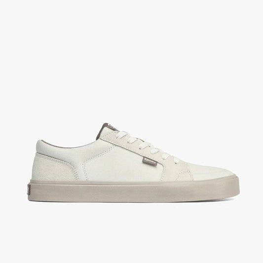 Minimalist off-white low-top sneaker with beige sole and subtle logo tag on side