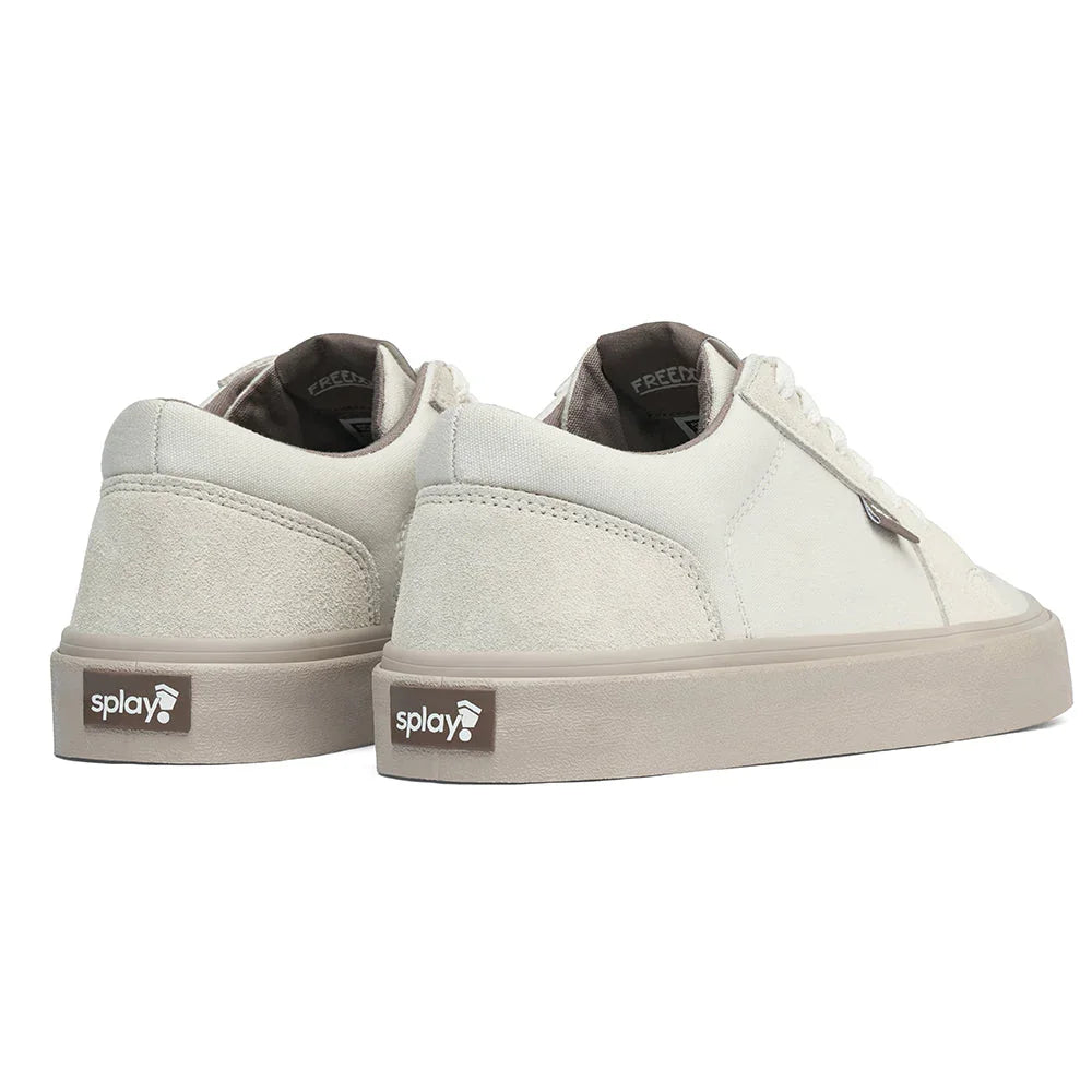 Pair of off-white canvas and suede sneakers with beige soles and splay logo on heel tab