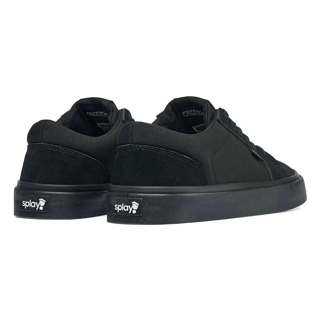 Pair of black Splay low-top sneakers with suede details and logo on the heel against white background