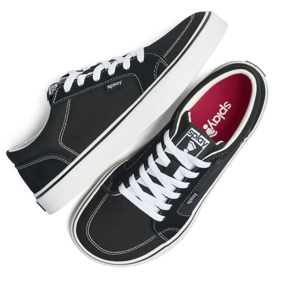 Black and white Splay low-top canvas sneakers with white laces and red insoles