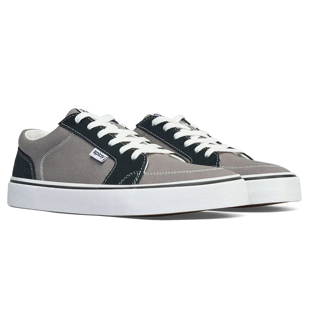 Low-top gray and black canvas sneakers with white laces and thick white rubber soles