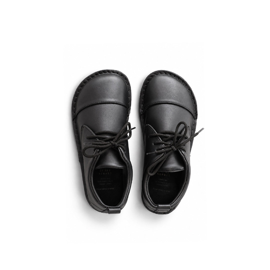 A pair of black leather lace-up shoes shown from a top-down view on a clean white background.