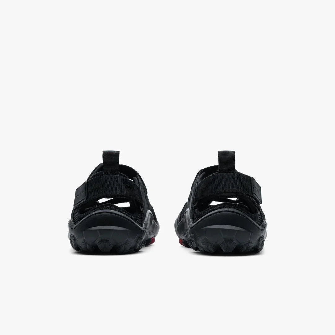 Rear view of black Vivobarefoot Tracker women's sandals with adjustable heel straps on white background