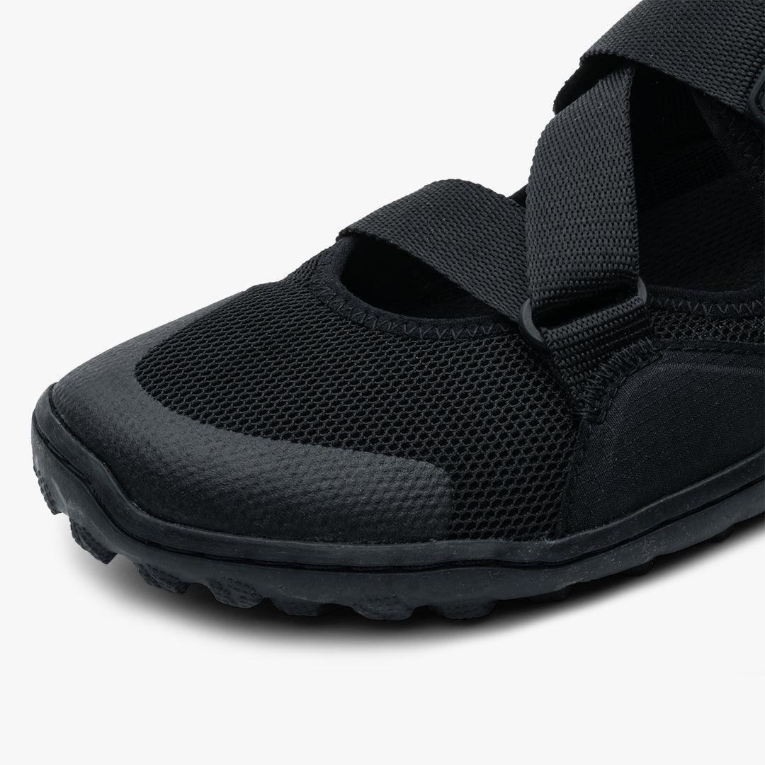 Close-up of black Vivobarefoot Tracker women's sandal with mesh upper and adjustable strap